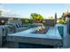 Cozy outdoor fire pit with comfortable seating, perfect for enjoying evenings by the pool at 136 E Vera Ln, Tempe, AZ 85284