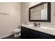Simple bathroom featuring single sink vanity with black cabinets at 16800 E El Lago Blvd # 2076, Fountain Hills, AZ 85268