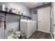Laundry room featuring a washer, dryer, storage shelf and vinyl flooring at 16800 E El Lago Blvd # 2076, Fountain Hills, AZ 85268
