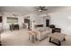 Open-concept living room with neutral decor, ceiling fans, and a dining area at 16800 E El Lago Blvd # 2076, Fountain Hills, AZ 85268