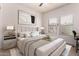 Inviting bedroom with a decorative bed, accent pillows, neutral decor, and natural light at 16800 E El Lago Blvd # 2076, Fountain Hills, AZ 85268