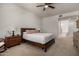 Cozy main bedroom featuring neutral color palette, ceiling fan, carpet, and ensuite bathroom at 16800 E El Lago Blvd # 2076, Fountain Hills, AZ 85268