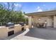 Community outdoor kitchen with built in grills and covered patio featuring a dining table at 16800 E El Lago Blvd # 2076, Fountain Hills, AZ 85268