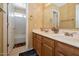 Bathroom featuring a double sink vanity and a shower-tub combination with tile surround at 1711 W Houston Ave, Gilbert, AZ 85233
