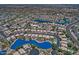 Aerial view of a residential community featuring waterfront homes, lush landscaping, and private pools at 1741 S Clearview Ave # 13, Mesa, AZ 85209