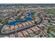 Aerial view of a suburban neighborhood showcasing waterfront properties, manicured lawns, and community landscaping at 1741 S Clearview Ave # 13, Mesa, AZ 85209