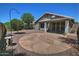 Backyard with patio and landscaping featuring gravel and mature trees at 1741 S Clearview Ave # 13, Mesa, AZ 85209
