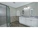 Bathroom boasts double vanity, framed mirrors, and a walk-in shower at 1741 S Clearview Ave # 13, Mesa, AZ 85209