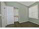 Bedroom featuring closet, shuttered window, wood-look tile flooring, and neutral paint at 1741 S Clearview Ave # 13, Mesa, AZ 85209
