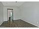 Spacious bedroom with wood-look tile flooring and neutral paint at 1741 S Clearview Ave # 13, Mesa, AZ 85209