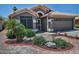 Charming single-story home with well-maintained landscaping, desert accents, and a two-car garage at 1741 S Clearview Ave # 13, Mesa, AZ 85209