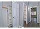 Hallway with gray walls, wood look tile floors, and storage at 1741 S Clearview Ave # 13, Mesa, AZ 85209
