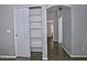 Hallway with closet and archway, showing tiled floors and neutral paint at 1741 S Clearview Ave # 13, Mesa, AZ 85209