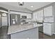 Updated kitchen featuring white cabinets, granite countertops, stainless steel appliances, and modern fixtures at 1741 S Clearview Ave # 13, Mesa, AZ 85209