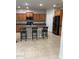 Well-appointed kitchen featuring a center island with seating, stainless steel appliances, and ample cabinet space at 2018 W Marconi Ave, Phoenix, AZ 85023
