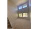 Spacious living room with carpet, high ceilings and multiple windows, providing natural light and a view at 2018 W Marconi Ave, Phoenix, AZ 85023