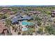 Stunning aerial view of an estate home with a backyard pool and spa, surrounded by lush desert landscaping at 20801 N 90Th Pl # 255, Scottsdale, AZ 85255