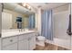 Bathroom featuring a vanity with storage, sink, framed mirror, and a shower with tub at 20801 N 90Th Pl # 255, Scottsdale, AZ 85255