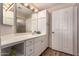 Bright bathroom featuring a vanity with storage, ample counter space, and a mirror with overhead lighting at 20801 N 90Th Pl # 255, Scottsdale, AZ 85255