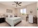 Relaxing bedroom with a ceiling fan, window, desk, and calming natural light at 20801 N 90Th Pl # 255, Scottsdale, AZ 85255