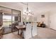 Dining area with a modern table, comfortable seating, and sliding glass doors leading outside at 20801 N 90Th Pl # 255, Scottsdale, AZ 85255