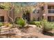 Multi-level apartment building featuring well-maintained landscaping, trees, and walkways at 20801 N 90Th Pl # 255, Scottsdale, AZ 85255