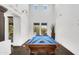 Bright game room boasts tall ceilings, pool table, and ample natural light at 20801 N 90Th Pl # 255, Scottsdale, AZ 85255