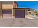 Garage featuring two stalls and brown doors at 20801 N 90Th Pl # 255, Scottsdale, AZ 85255