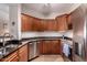 Modern kitchen with dark granite countertops and stainless steel appliances, perfect for cooking at 20801 N 90Th Pl # 255, Scottsdale, AZ 85255