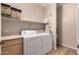 Laundry area features washer, dryer, shelving for storage and vinyl floors at 20801 N 90Th Pl # 255, Scottsdale, AZ 85255