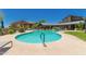 Community pool with blue water, clear skies, and nearby buildings for a relaxing outdoor experience at 20801 N 90Th Pl # 255, Scottsdale, AZ 85255