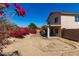 Spacious backyard featuring desert landscaping and a covered patio at 22322 W Loma Linda Cir, Buckeye, AZ 85326