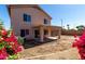 View of the rear exterior featuring a covered patio and low maintenance landscaping at 22322 W Loma Linda Cir, Buckeye, AZ 85326