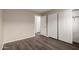 Bedroom featuring wood-look floors, neutral walls, and closet with sliding doors at 22322 W Loma Linda Cir, Buckeye, AZ 85326