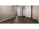 Bedroom with wood-look floors, neutral walls and double door closet at 22322 W Loma Linda Cir, Buckeye, AZ 85326