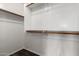 Walk-in closet with built-in shelving and wood-look floors at 22322 W Loma Linda Cir, Buckeye, AZ 85326