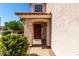 Front entrance featuring decorative plants and a covered porch at 22322 W Loma Linda Cir, Buckeye, AZ 85326