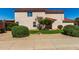 Home featuring a well-maintained lawn and decorative desert landscaping at 22322 W Loma Linda Cir, Buckeye, AZ 85326
