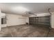 Spacious two car garage featuring automatic door, shelving and water heater at 22322 W Loma Linda Cir, Buckeye, AZ 85326
