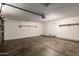 Spacious two car garage featuring automatic door and shelving at 22322 W Loma Linda Cir, Buckeye, AZ 85326