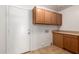 Laundry room features washer hookups, cabinetry and a door to the exterior at 22322 W Loma Linda Cir, Buckeye, AZ 85326
