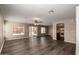 Bright living room with modern vinyl floors and access to outdoor patio at 22322 W Loma Linda Cir, Buckeye, AZ 85326