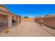 Expansive backyard with gravel landscaping and covered patio space at 22543 W Cocopah St, Buckeye, AZ 85326