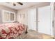 Comfortable bedroom features neutral paint, ceiling fan, and sunny window at 22543 W Cocopah St, Buckeye, AZ 85326