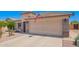 Attractive single-story home with a two-car garage, desert landscaping, and a well-maintained front yard at 22543 W Cocopah St, Buckeye, AZ 85326