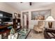 Open-concept living area with a partial view into the adjacent kitchen and a cozy sitting area at 22543 W Cocopah St, Buckeye, AZ 85326