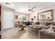 Spacious living room features tile floors, neutral walls, comfortable furniture, and ample natural light at 22543 W Cocopah St, Buckeye, AZ 85326