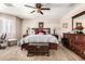 Cozy main bedroom with plush carpet, ceiling fan, and dresser at 22543 W Cocopah St, Buckeye, AZ 85326