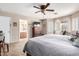Spacious main bedroom boasts carpet flooring, shutters and ensuite bathroom at 22543 W Cocopah St, Buckeye, AZ 85326