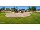 Community playground and green space with play equipment and turf at 22543 W Cocopah St, Buckeye, AZ 85326